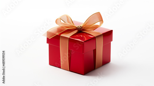 Beautiful red gift box with a gold ribbon bow. Concept of Christmas or Valentine's day © lisssbetha