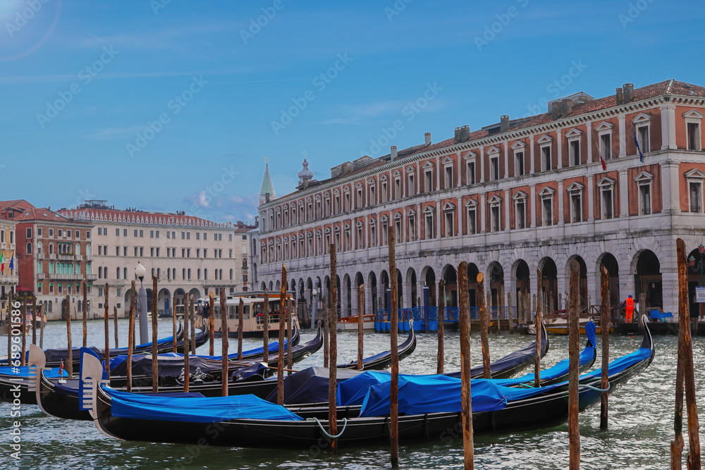 Venice postcard with gondolas, beautiful gondolas moored in the Grand Canal of Venice, Veneto, Italy