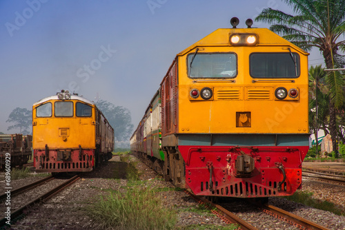 Passenger train by diesel locomotive on the railway.