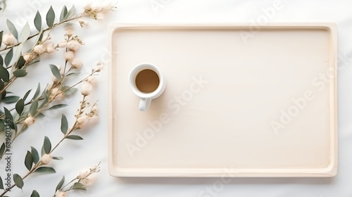 Cup of coffee on white wooden serving tray and ducal photo