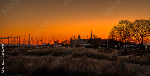 Panoramic view of Kronborg Castle and a silhouette at sunrise, Elsinore, Denmark