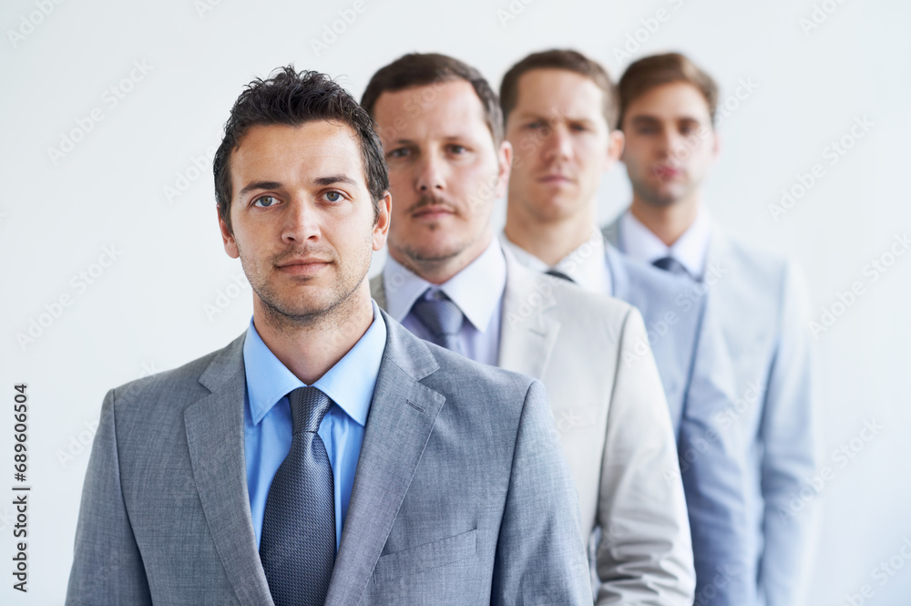 Men, portrait and serious for job interview, finance career and ready for selection process. Worker, corporate accountant in suit or professional in workplace, colleagues in background and confident Men, portrait and serious for job interview, finance career and ready for selection process. Worker, corporate accountant in suit or professional in workplace, colleagues in background and confident