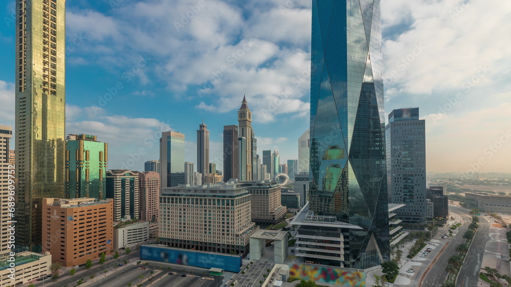 Dubai International Financial district aerial night to day timelapse. Panoramic view of business office towers.