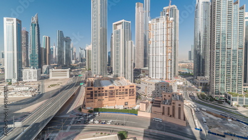 Aerial view of Dubai Downtown skyline with many towers timelapse.