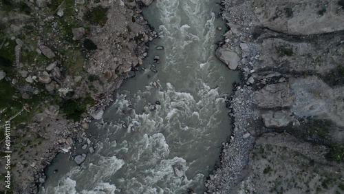 Aerial drone view of road along with Astore river in Karakoram Range in Himalayas mountains near Astore Valley along Karakoram Highway Gilgit Baltistan Pakistan