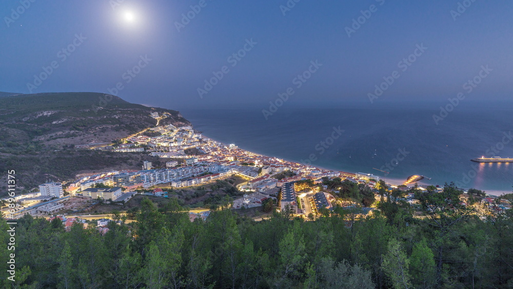 Aerial view of the coastline of the village of Sesimbra day to night timelapse. Portugal