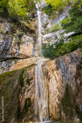 Creek and huge waterfall in mountain at Tolmin in Slovenia.