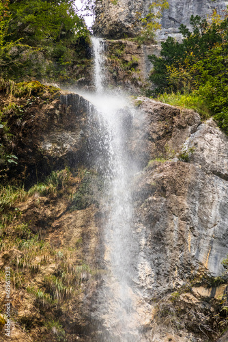 Creek and huge waterfall in mountain at Tolmin in Slovenia.