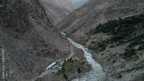 Aerial drone view of road along with Astore river in Karakoram Range in Himalayas mountains near Astore Valley along Karakoram Highway Gilgit Baltistan Pakistan