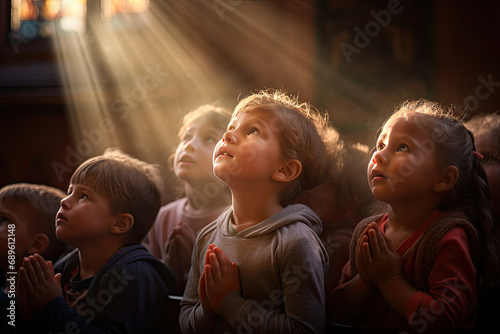kids pray to god and jesus in the church