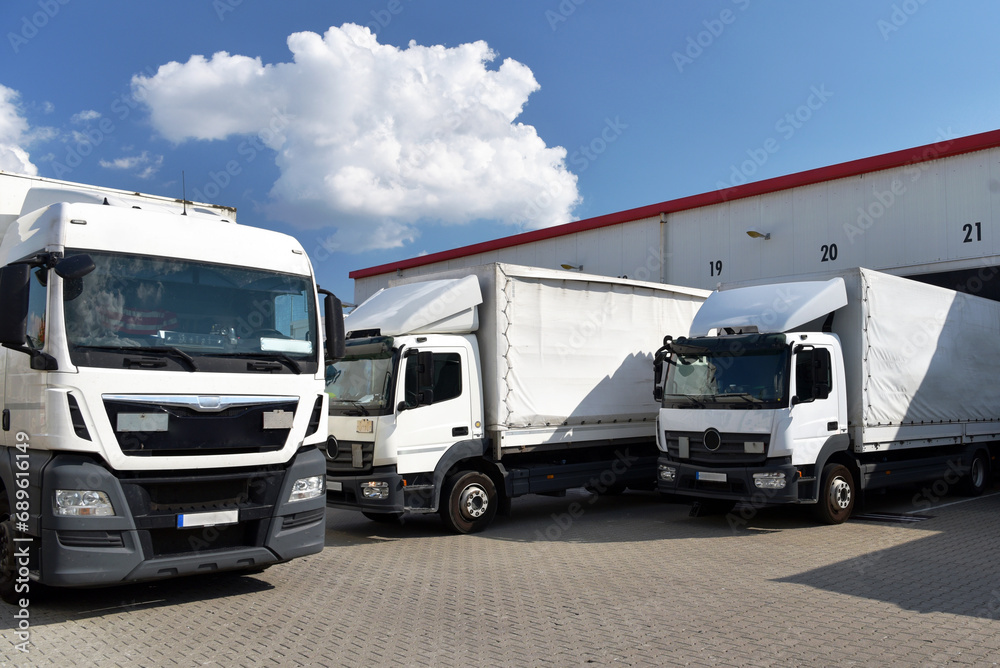 Trucks loading at a depot of a forwarding agency - Transport and logistics in goods trade