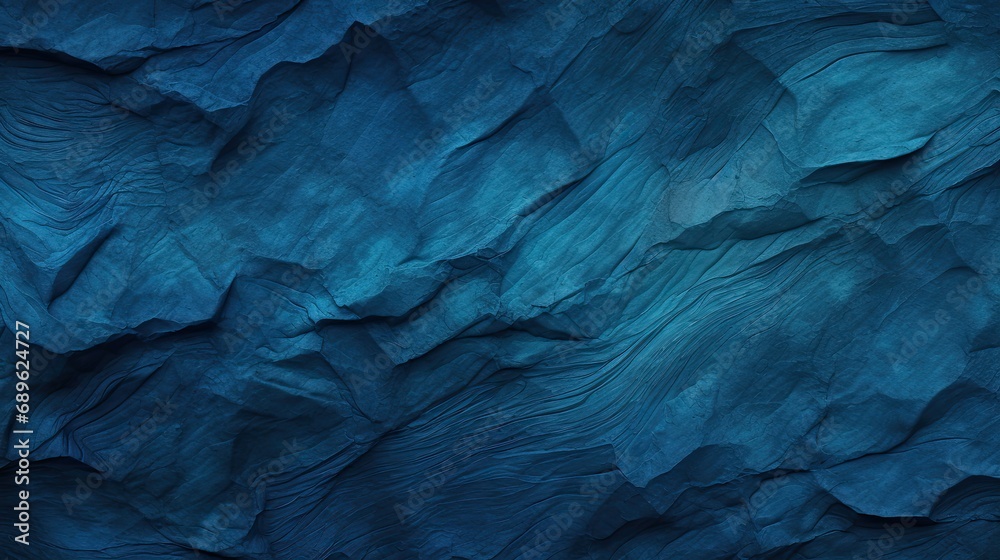 The textured background is dark blue, indigo in color. Abstract backdrop with wave relief.
