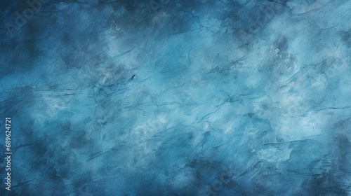 A blue wall with a texture. Dark blue vignette on the bottom and top. Cracks and stains. Abstract background for web design