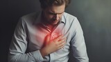 An individual clutching their chest in pain, illustrating a heart attack with visible stroke symptoms, emphasizing the importance of cardiovascular health awareness and emergency response.