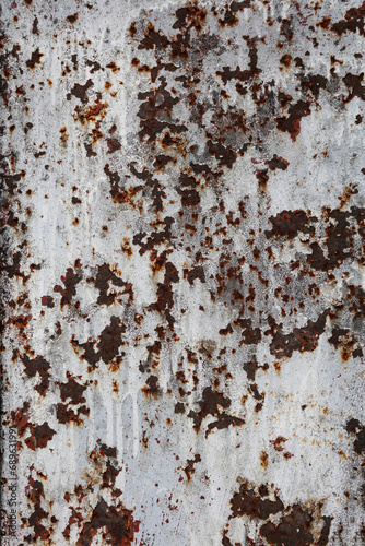 A close-up of a rusty metal door or wall. Rusty spots on iron.
