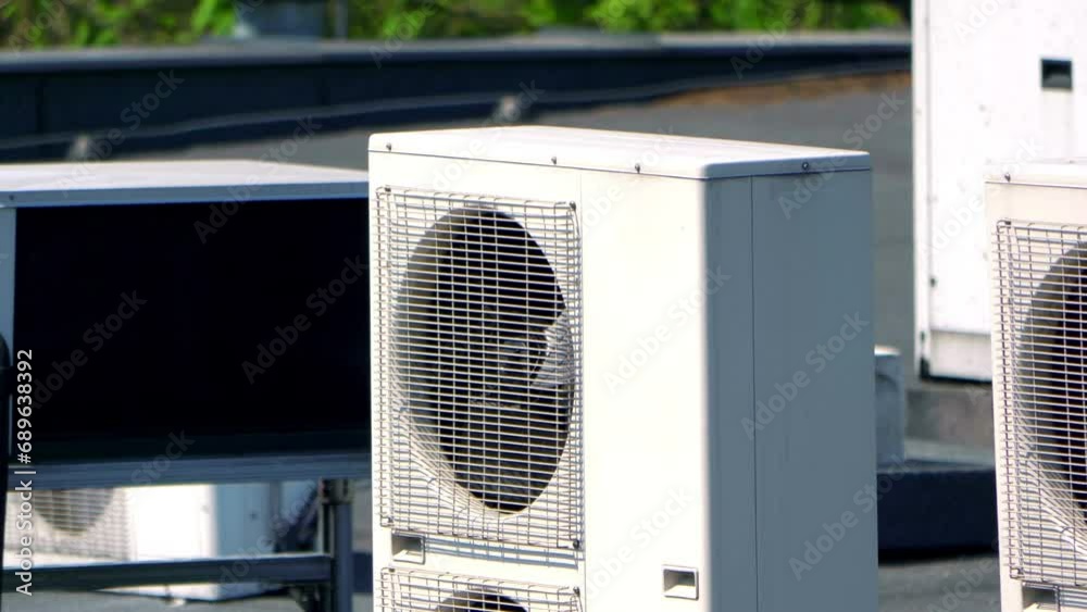 Modern Air Conditioning Units Installed on the Roof of a Commercial Building in 4k slow motion 60fps Modern Air Conditioning Units Installed on the Roof of a Commercial Building in 4k slow motion 60fps