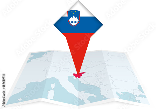 Slovenia pin flag and map on a folded map