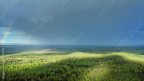 Impending Downpour and Vibrant Rainbow, An Aerial Meteorological Marvel. Aerial Drone Shot.