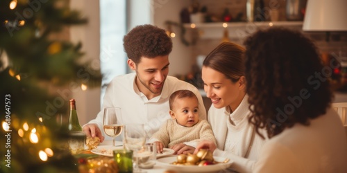 Happy little baby boy and diverse family in a christmas dinner in a modern home