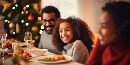 Happy little girl and diverse family in a christmas dinner in a modern home 