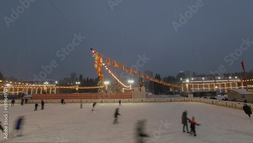 Timelapse, in heavy snow, people ride a skating rink. January 13 Kiev Ukraine