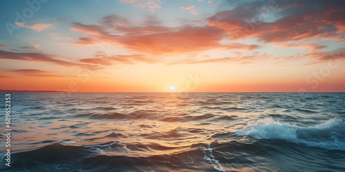 sunset over the sea.A sunset over the ocean with a blue sky and the sun setting over the horizon.AI Generative 