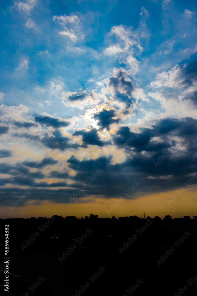 Clouds and the sunset over the buildings