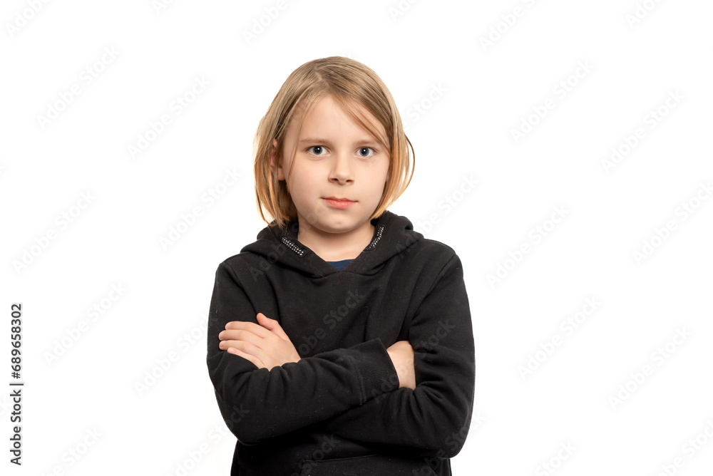 Neutral-faced ten-year-old lad with flowing hair, captured against a pristine white backdrop Neutral-faced ten-year-old lad with flowing hair, captured against a pristine white backdrop