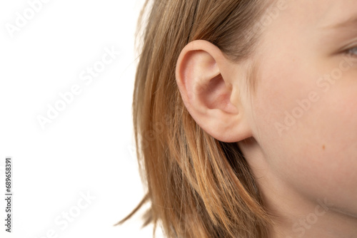 ear of a young child close-up on a white background photo