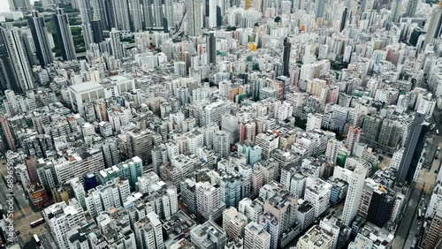 Urban Buildings of Hong Kong City as Big Asia Metropolis on Victoria Island. Cityscape Concept of Over Populated Old Town in China. High Panoramic View on Famous Kowloon Area in Traditional HK Center