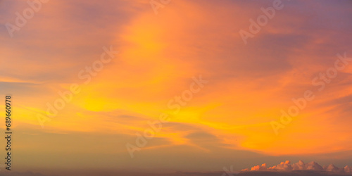 Sunset sky clouds in the evening with Orange, Yellow sunlight on Golden hour, Nature background  © Nature Peaceful 