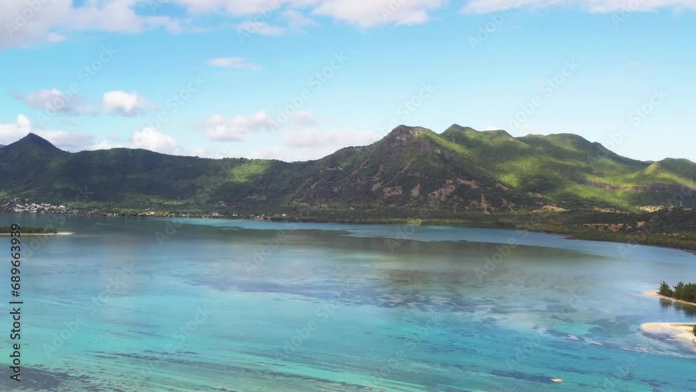 Panoramic aerial drone view of the coast of Mauritius with Benetier island, Black River, Mauritius. Panoramic aerial drone view of the coast of Mauritius with Benetier island, Black River, Mauritius.