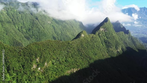 Panoramic aerial drone view of Cirque de Salazie with Piton d'Anchaing and Piton des Neiges in the background, Saint Andre, Reunion. photo