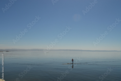 doing paddle board in the pacific ocean in Chile © gustavo