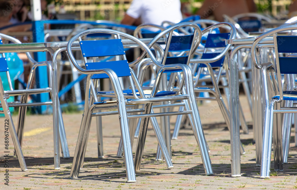 Metal chairs with blue backs in a cafe Metal chairs with blue backs in a cafe