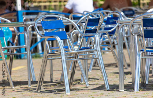 Metal chairs with blue backs in a cafe