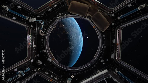 View from a porthole of space station on the Earth background. Elements of this image furnished by NASA. photo