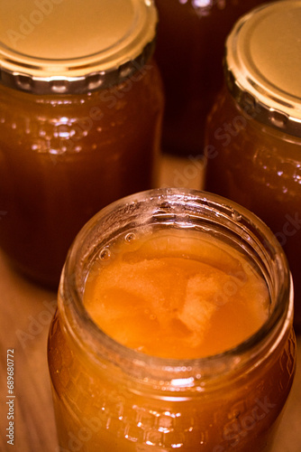 Aerial view of open honey jar close up