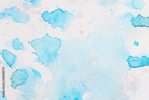 Abstract liquid art background. Blue watercolor translucent blots on white paper.