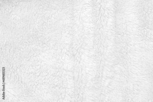 White clean wool texture background. light natural sheep wool. white seamless cotton. texture of fluffy fur for designers. close-up fragment white wool carpet.. photo