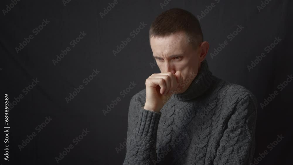 Portrait of a sad and lonely man in a dark room. Concept of mental health and depression. Portrait of a sad and lonely man in a dark room. Concept of mental health and depression.