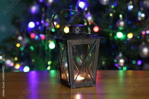 Lantern on the background of a Christmas tree