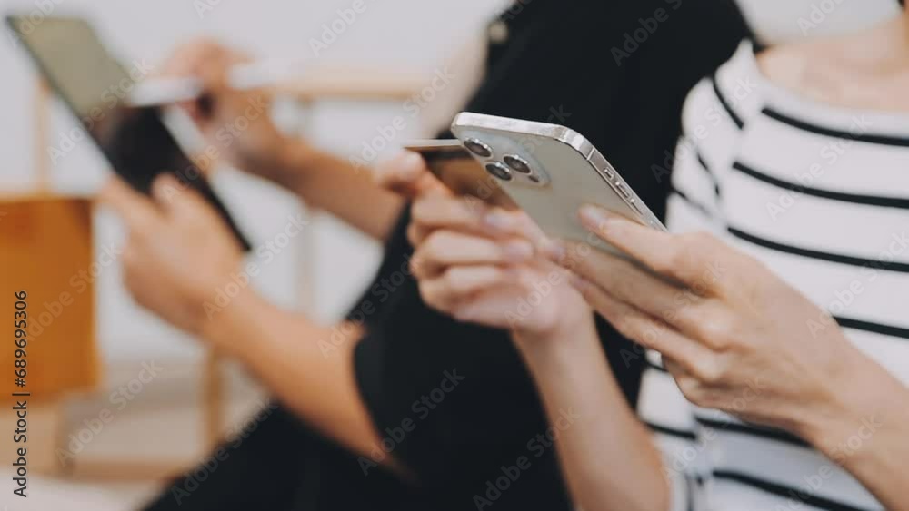 Startup small business SME, Entrepreneur owner using smartphone or tablet taking receive and checking online purchase shopping order to preparing pack product box. Selling online ideas concept Startup small business SME, Entrepreneur owner using smartphone or tablet taking receive and checking online purchase shopping order to preparing pack product box. Selling online ideas concept