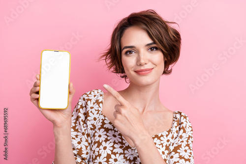 Bild auf Leinwand Portrait of cute lovely person indicate finger arm hold empty space smart phone
