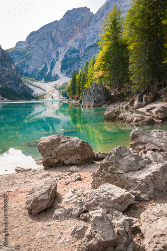 Fototapeta Naklejka Na Ścianę i Meble -  Rocks along a beautiful green-blue colored lake in the European Alps