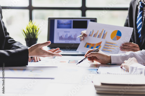 Business people meeting together brainstorming business strategy analysis and investment planning. Financial consultant discuss analysis financial chart and market growth graph for business planning.