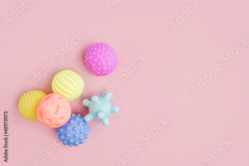 Sensory balls for kids to improve children's cognitive and physical processes. Concept of massage textured balls to develop tactile sensations. Copy space for logo. Banner.Textured plastic multi ball