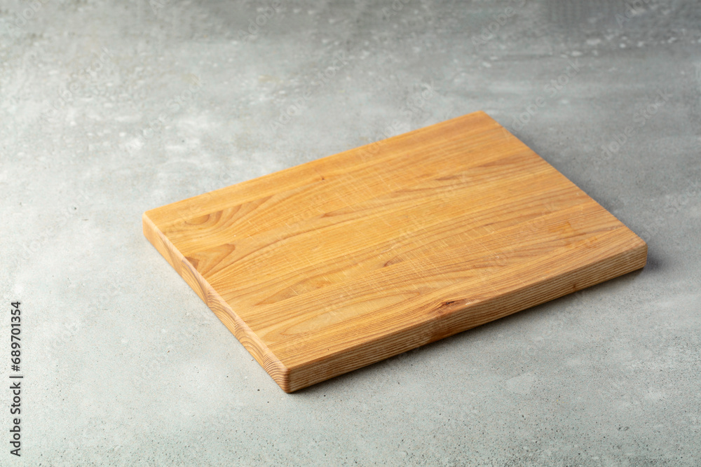 Fototapeta premium Cutting board on a stone table.