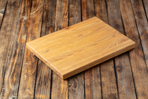 Cutting board on a wooden table.