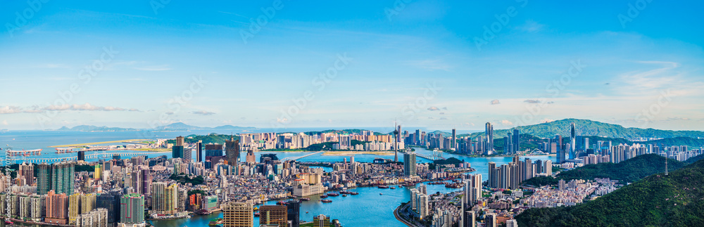 Aerial view of Zhuhai and Macau city skyline scenery under blue sky, China. Panoramic view.
